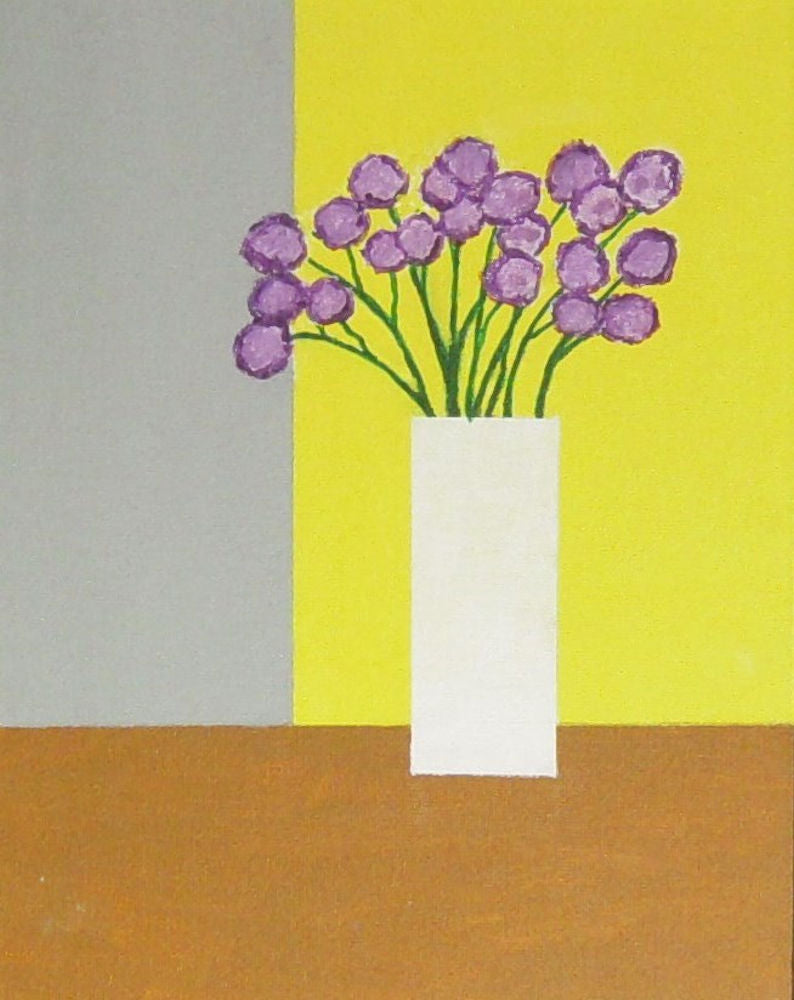 Purple Flowers in a White Vase